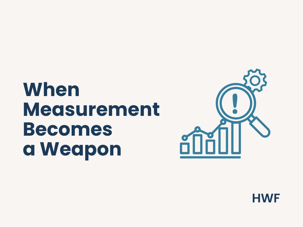 illustration of a magnifying glass highlighting a warning symbol over a bar chart